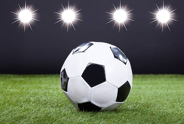 istock Soccer Ball On Green Pitch 496925242