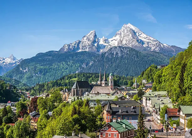Historic town of Berchtesgaden with snowy Watzmann mountain in spring, Berchtesgadener Land, Upper Bavaria, Germany