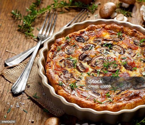 Mushroom Quiche On A Rustic Wooden Table Stock Photo - Download Image Now - 2015, Baked, Baked Pastry Item