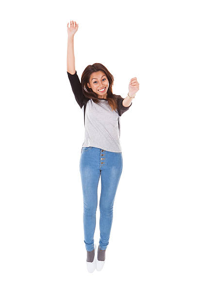 istock Excited Woman Jumping Against White Background 496926398