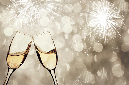 Champangne glasses on sparkling background - New Year concept