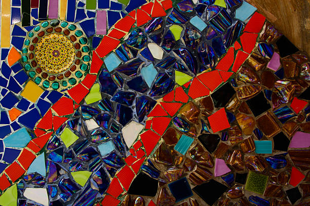 Hand made circular mosaic on wall decorated in Wat Pha Sorn Kaew. Wat Pha Sorn Kaew meaning: temple on a glass cliff, also known as Wat Phra Thart Pha Kaew, is a Buddhist monastery and temple at Thang Daeng village hill’s holy place, Camp Son sub district, Khao Kho District , Phetchabun Province, in north-central Thailand. The Wat is set on an 830m peak,The main pagoda and surrounding buildings are adorned with over 5 million colorful mosaic tiles and pottery items and is set in a mountain location. 5 sitting Buddha statues were already finished. There is a stained glass gazebo and a smaller pagoda in the gardens.