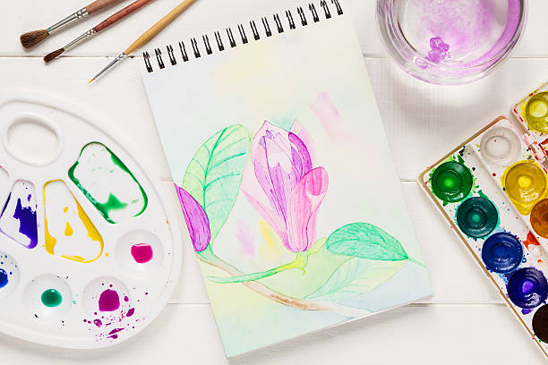 istock Watercolor magnolia flower in artistic notepad 496927618