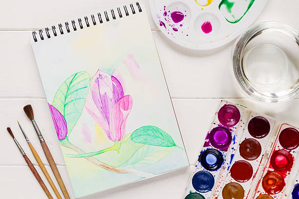 istock Watercolor magnolia flower in artistic notepad 496927664