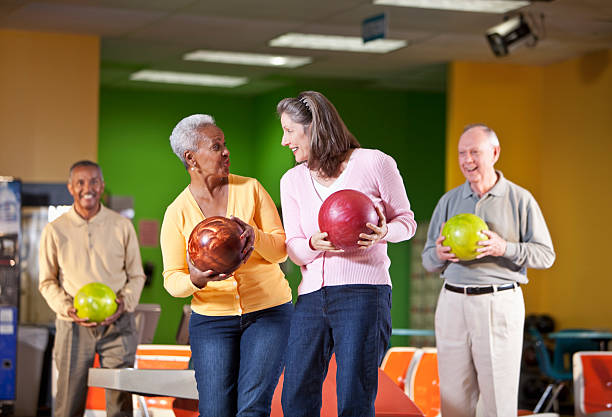 istock Seniors at bowling alley 496941393