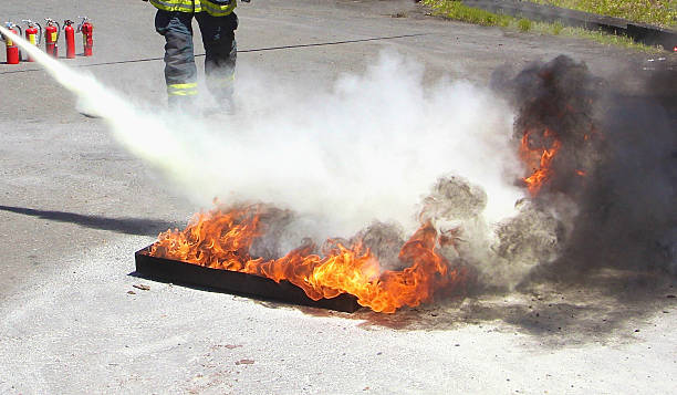 Fireman's Demonstration Of Fire Extinguisher stock photo