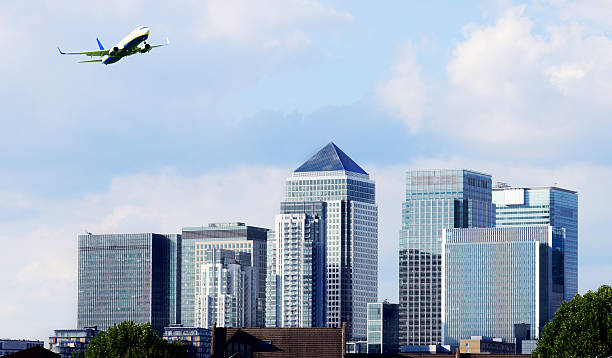 istock Airplane Flying over Financial District, London - England 496944865
