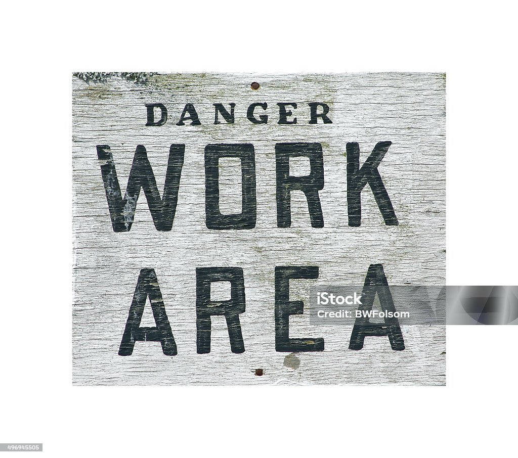 Danger work area sign An old danger work area sign on a black background. Black Color Stock Photo