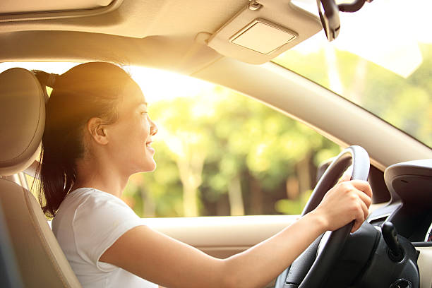 istock happy woman driver driving her car 496945993