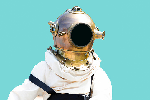 Old diving suit isolated with clipping path and copy space