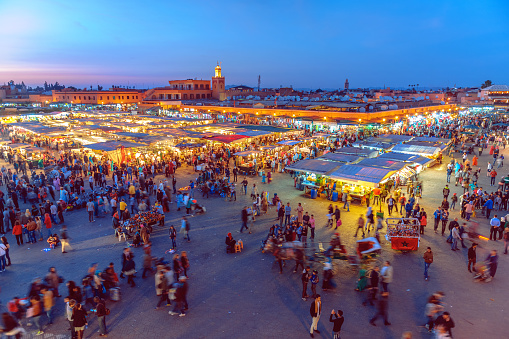 Famous Djemaa El Fna Square in early evening light, Marrakech, Morocco with the Koutoubia Mosque, Northern Africa.Nikon D3x