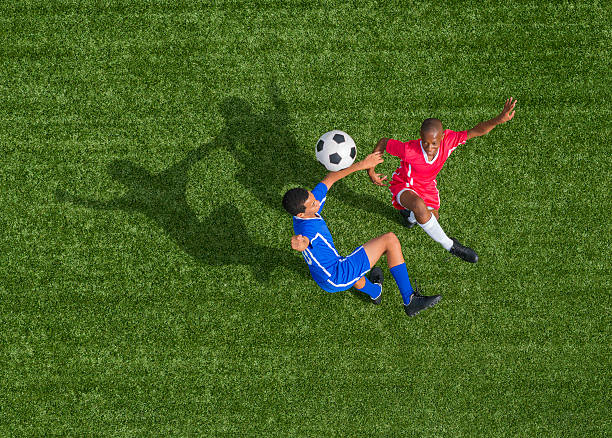 istock Young Footballers In Action 496947741