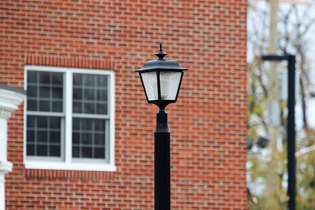 istock Lamp Post Against Backdrop of Brick Building 496947796