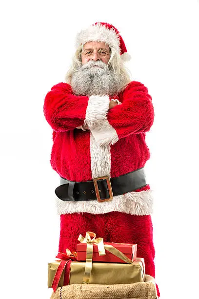 Photo of santa claus standing with his arms crossed