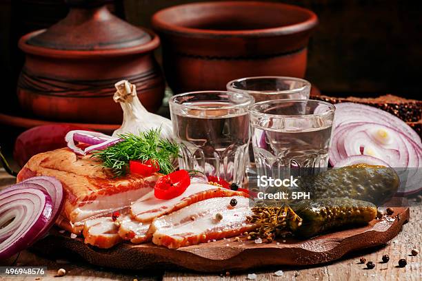 Russian Tradition Cold Vodka And A Snack Of Bacon Pickles Stock Photo - Download Image Now