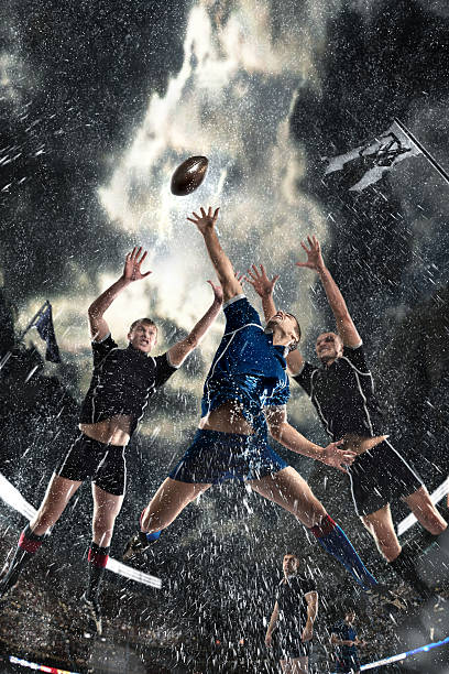 Sports, game, fighting, rain, stadium - Rugby players on a stadium