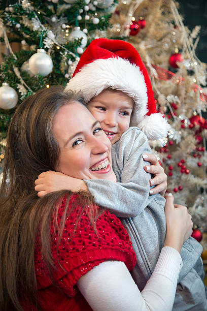 istock Mother and son embracing at Christmas. 496949844