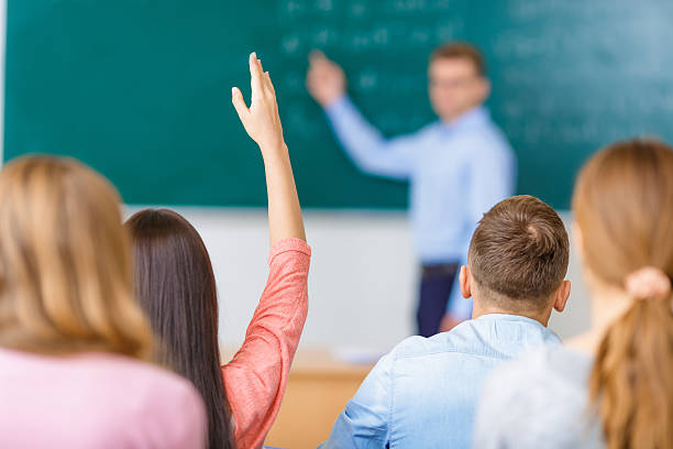 istock One of students raises arm to answer the question 496949986