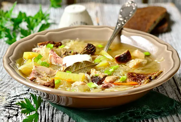 Russian sour cabbage soup (shchi) with dried mushrooms.
