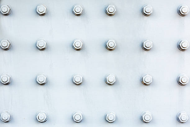 Closeup steel plate background with bolts and nuts, Harbour Bridge, full frame horizontal composition with copy space