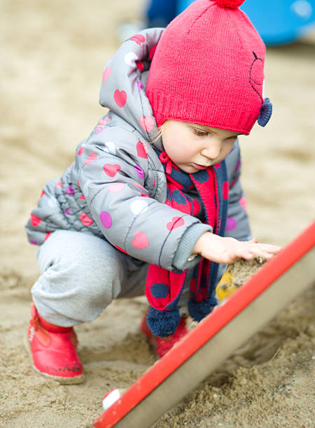 istock Little girl is playing on playground 496951700