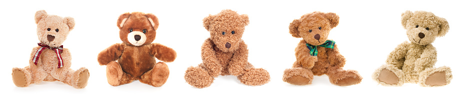 A teddy bear wearing a sweater on a white background. The Teddy has been used for years and shows loving wear.