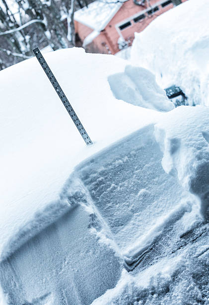 istock Yardstick Measuring Deep Winter Snow On Car Hood 496952066