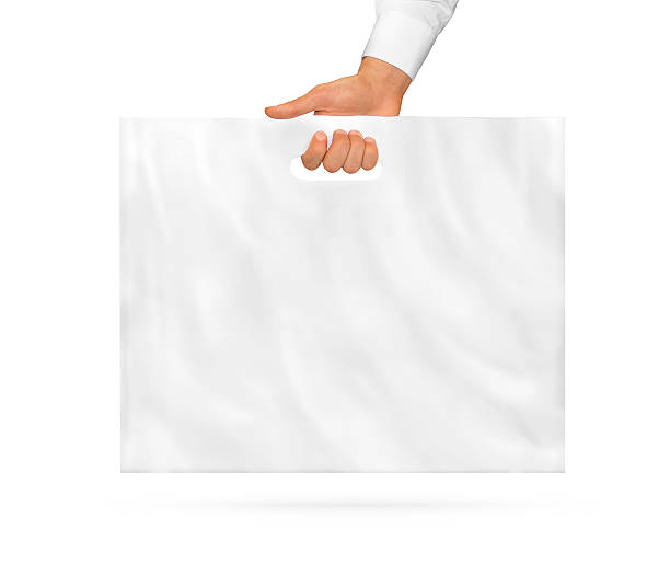 istock Big blank plastic bag mock up holding in hand. 496952304
