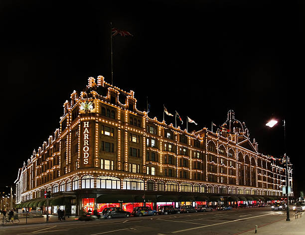 Harrods Christmas London, United Kingdom - January 22, 2013: Famous Harrods luxury department store exterior during night with illuminated decorations for Christmas season in London harrods photos stock pictures, royalty-free photos & images