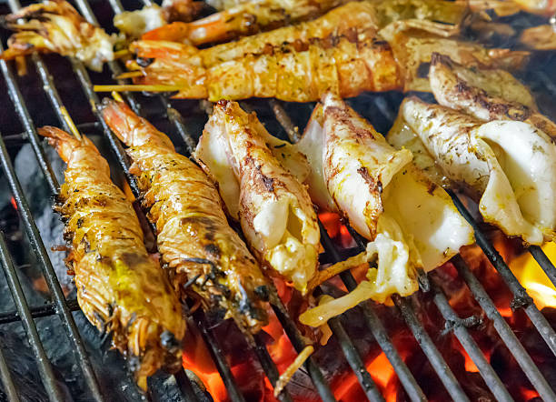 istock GRILLED SEAFOOD metal grill king size prawns 496953654