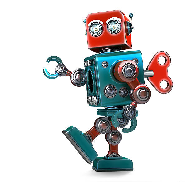 retro robot wound up with key. isolated with clipping path - robot bildbanksfoton och bilder