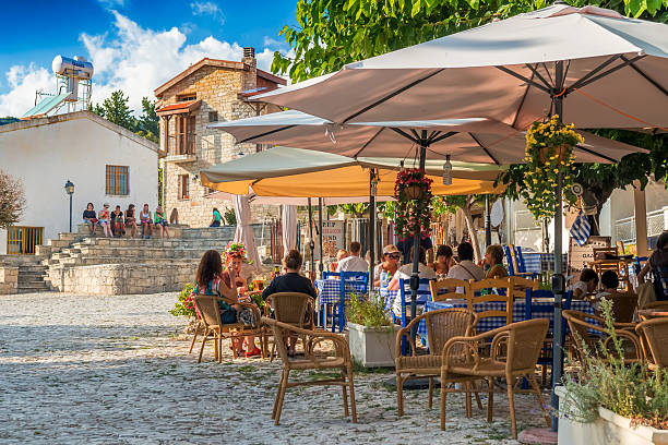 Street cafe's with tourists in Omodos village, Limassol District. Omodos, Cyprus - October 4, 2015: Street cafe's with tourists in Omodos village, Limassol District. limassol stock pictures, royalty-free photos & images