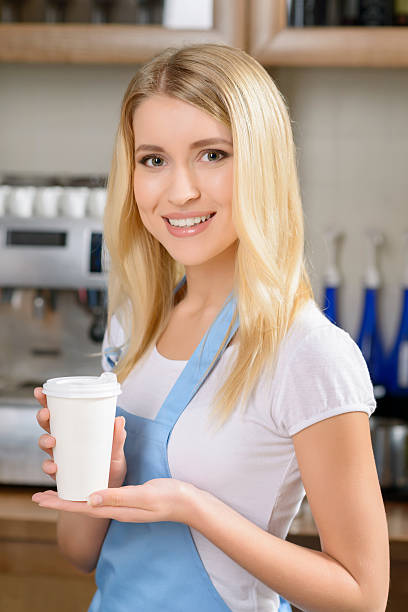 istock Pleasant waitress standing at a counter 496956284