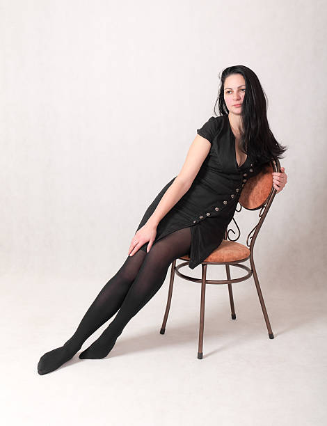 istock woman in a black dress 496959758
