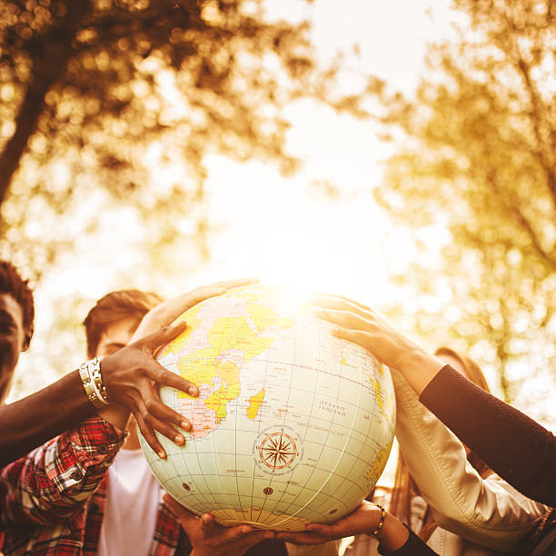 istock teenagers college student smiling with globe 496969753