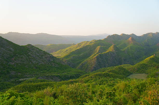 istock Beautiful lush green mountains with clear sky 496970197