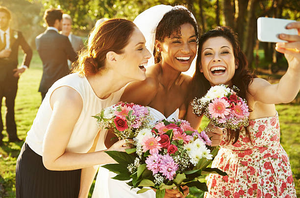 Three Happy Smiling Brides Looking Up with Bouquets on the White Backgrownd.  Please, view my wedding pictures here: http://img-fotki.yandex.ru/get/6100/76420281.0/0_879cb_75cf1b55_L.jpg