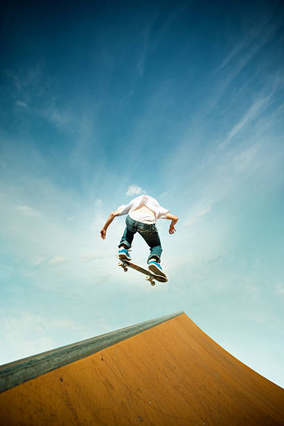 istock skater in jump over skating poligon ramp 496973245