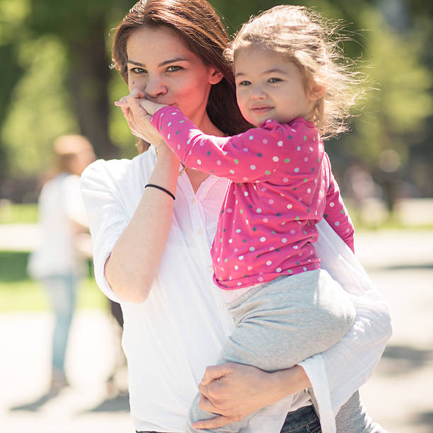 istock Mother And Daughter Taking A Walk In The Park 496974701