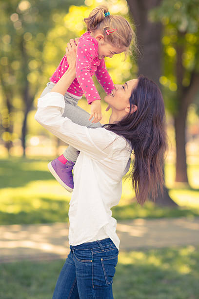 istock Mother And Daughter Playing In The Park 496974723
