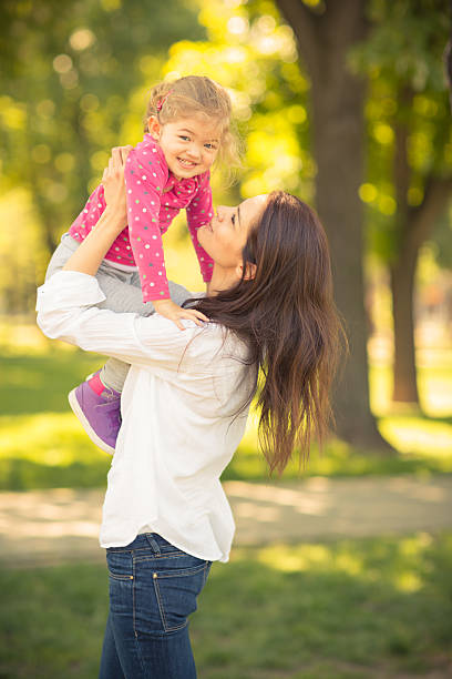 istock Mother And Daughter Playing In The Park 496974727