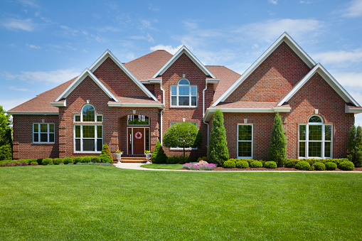 Welcoming Brick Home With Perfect Lawn. 
