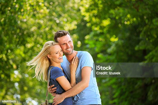 Happy Couple In A Park Stock Photo - Download Image Now - Couple - Relationship, Effortless, Lifestyles