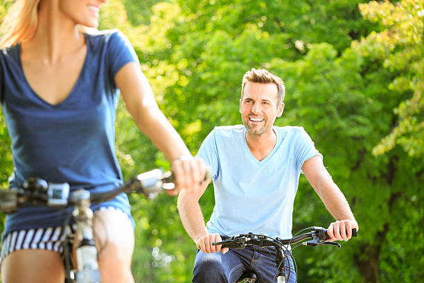 istock Happy couple cycling 496975429