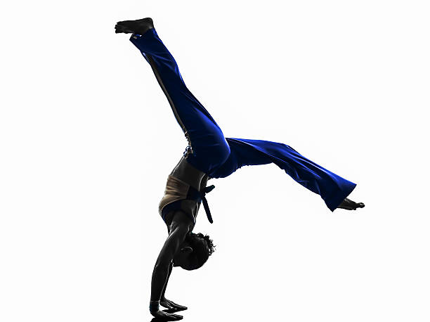 istock woman capoeira dancer dancing silhouette 496975583