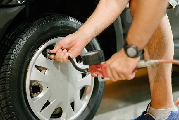 istock Tire air pressure check 496979118