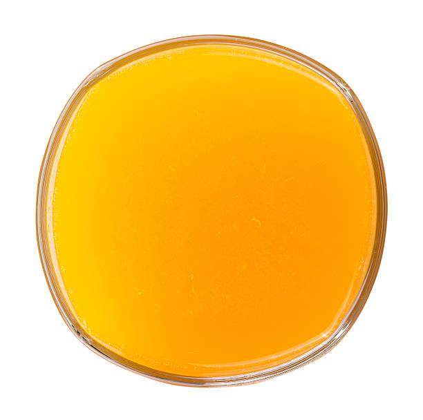 istock Glass of fresh orange juice on white background 496980202