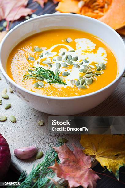 Pumpkin Soup On A Wooden Table Stock Photo - Download Image Now - 2015, Autumn, Bowl