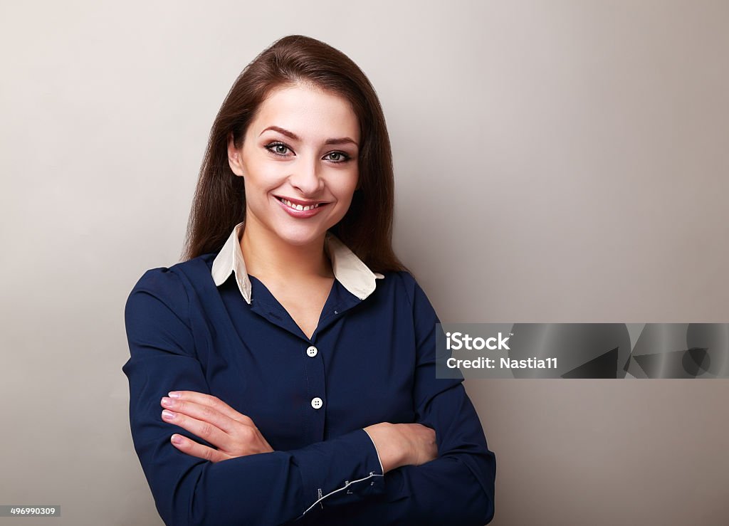 Beautiful business woman standing on grey background Adult Stock Photo