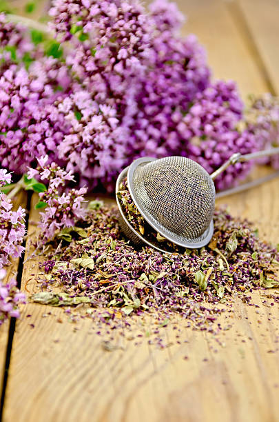 istock Herbal tea from dry and fresh oregano with strainer 496990775